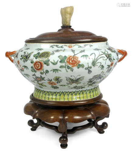 A POLYCHROMAE DECORATED PORCELAIN TUREEN DEPICTING BUTTERFLIES AND FLOWERS WITH WOOD COVER AND STAND, China, 19th ct - Cover very slightly chipped