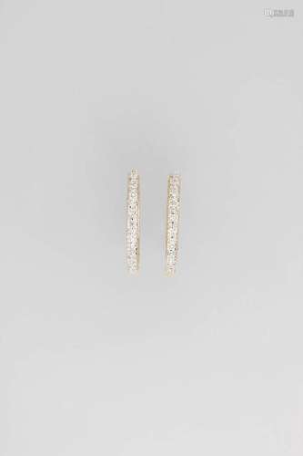 Pair of 14 kt gold hoop earrings with diamonds