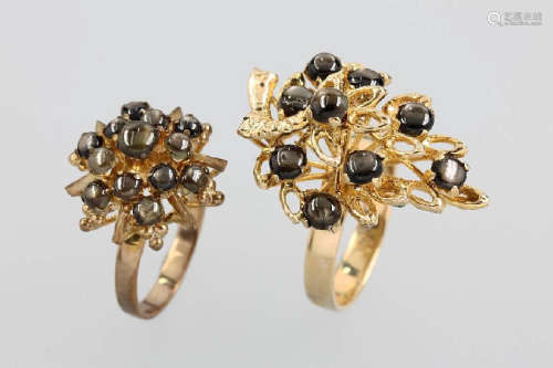 Lot 2 8 kt gold rings with black star sapphires