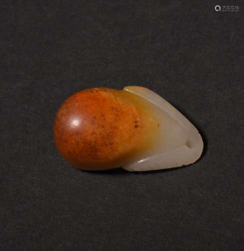 A  SMALL CARVED RUSSET JADE PENDANT , Qing Dynasty
