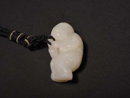 A CARVED WHITE JADE BOY'S PENDANT , Qing Dynasty