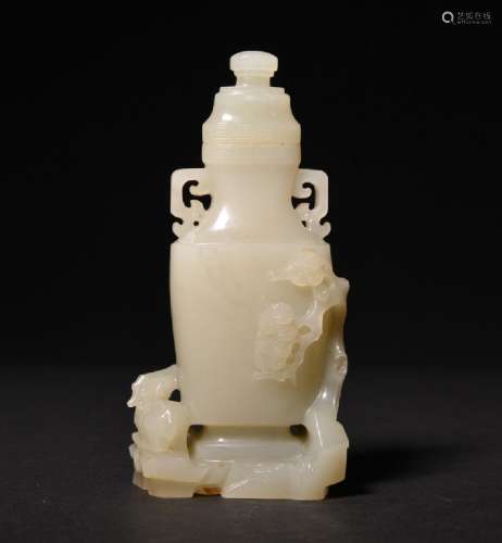 A FINE WHITE JADE CARVING OF VASE AND COVER , Qing