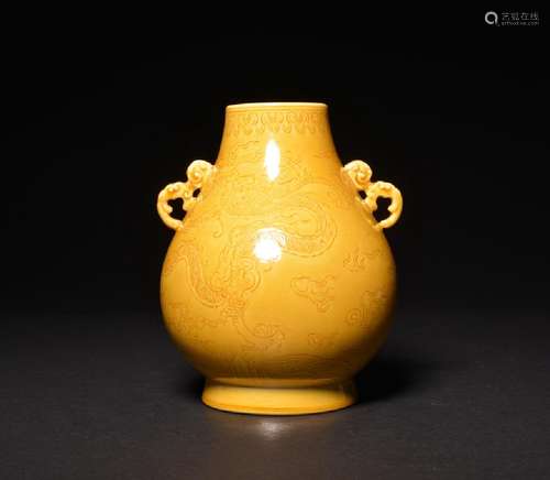 A CARVED YELLOW-GLAZED HU-FORM DRAGON VASE , Qing