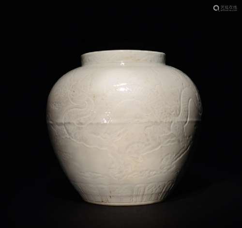A CARVED WHITE -GLAZED DRAGON JAR , Ming Dynasty