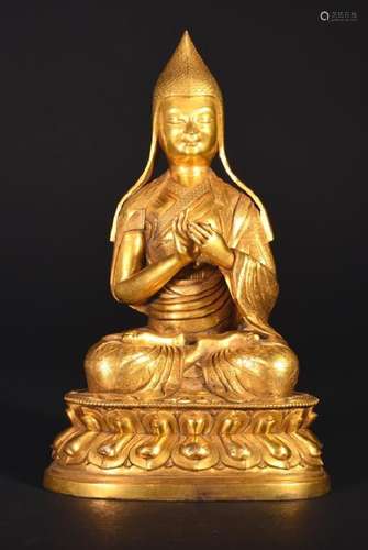 A GILT-BRONZE FIGURE OF GURU , Qing Dynasty