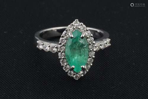 A WHITE GOLD AND EMERALD DIAMOND RING
