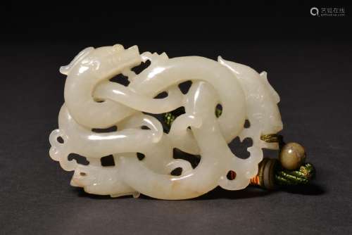 A CARVED WHITE JADE OPEN-WORK DRAGON PENDANT , Qing