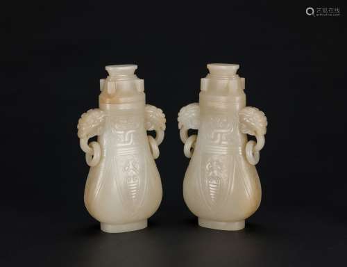 A Pair Of White Jade Carved Vases With Cover