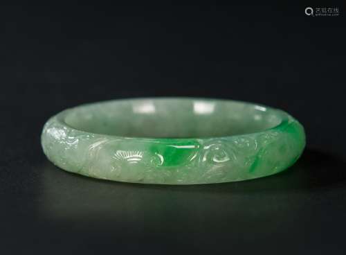 A Semi Translucent Apple Green Jadeite Carved ‘Dragon And Phoenix’ Bangle
