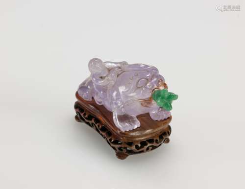 Qing-Amethyst Carved ‘Liu Hai and Toad’ Snuff  Bottle, With Wood Stand
