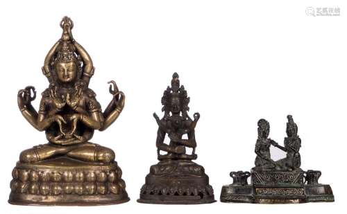 A Tibetan bronze Bodhisattva with traces of polychrome paint, probably 18thC; added two Oriental bronze groups of deities, H 8,5- 18,5 cm