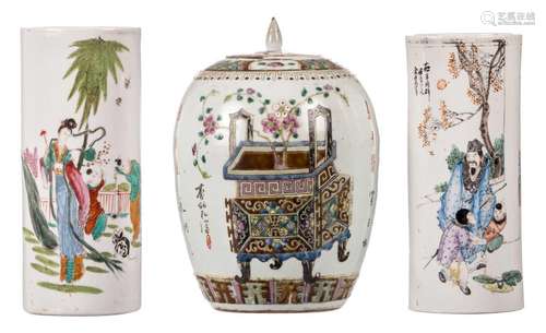 Two polychrome Chinese cylindrical vases, decorated with genre scenes, H 28 - 29 cm; added a Chinese famille rose ginger pot and cover decorated with flower baskets and calligraphic texts, H 30 cm