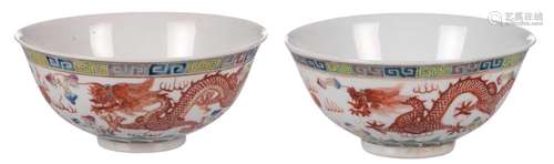 Two Chinese famille rose and polychrome decorated bowls with a dragon, a phoenix and a flaming pearl, with a Qianlong mark, H 6 - Diameter 14,3 cm