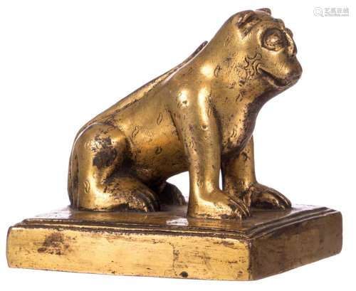 A Chinese gilt bronze animal on matching base, decorated with texts on top and to the bottom, 10 x 10 x 10 cm