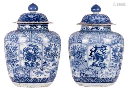 A pair of Oriental blue and white vases and covers, decorated with animals and flower branches, H 53 cm