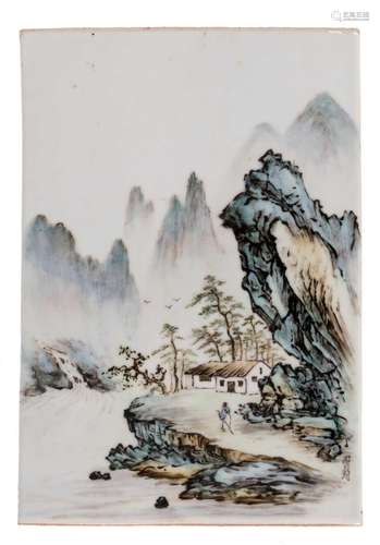 A Chinese polychrome plaque, decorated with a mountainous river landscape, signed, H 25,5 cm- W 17,5 cm