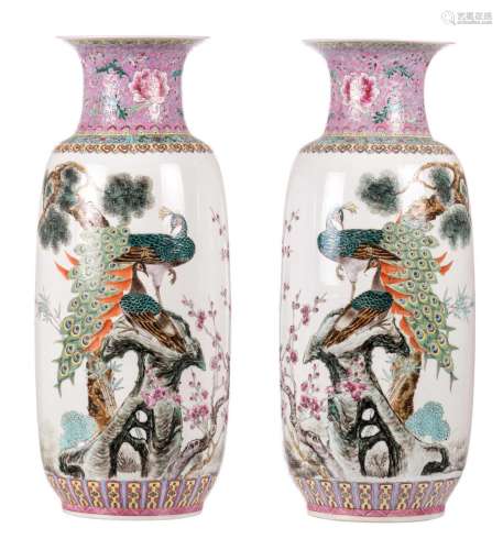 A pair of Chinese famille rose vases, decorated with peacocks, the three friends of winter, bamboo, and a calligraphic text, marked, H 60,7 cm
