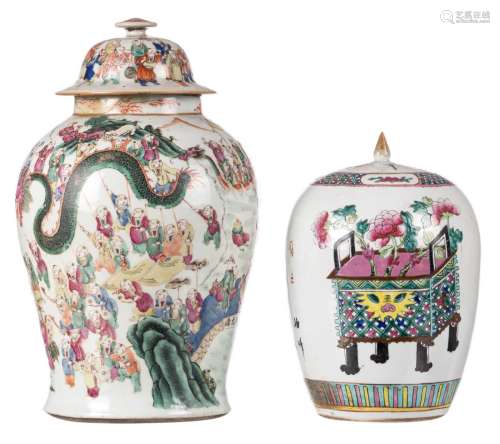 A Chinese famille rose vase and cover, overall decorated with an animated scene, H 44 cm (damage); added a ditto ginger jar and cover, decorated with flower baskets and calligraphic texts, H 30 cm