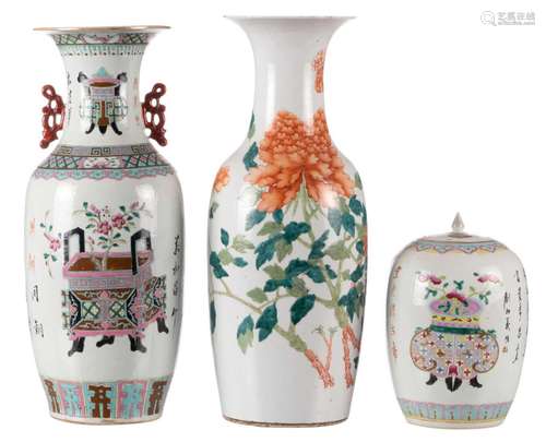 A Chinese polychrome decorated vase with flower branches, 19th C, H 60,5 cm; added a Chinese famille rose vase and ginger jar and cover, decorated with flower baskets and calligraphic texts, H 31,5- 59 cm