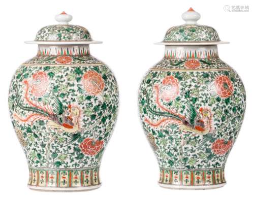 A pair of Chinese famille verte floral decorated vases and covers, with phoenixes, H 39- 41 cm