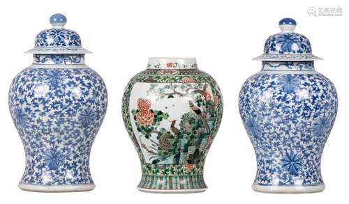 A pair of Chinese blue and white vases with covers; added a ditto famille verte vase, 19thC, H 35 - 46 cm (damage)