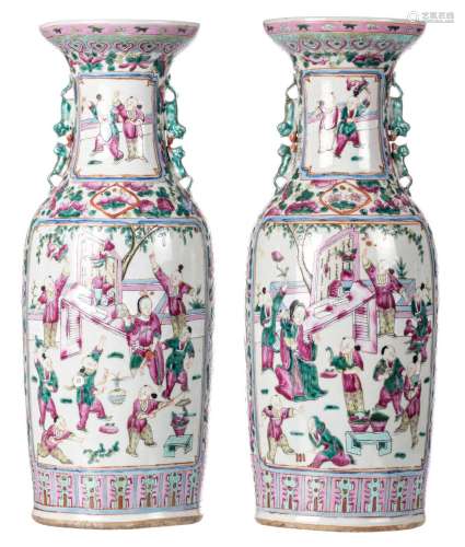 A pair of Chinese famille rose vases, decorated with birds and flower branches, the roundels with animated garden scenes, 19thC, H 58-58,5 cm