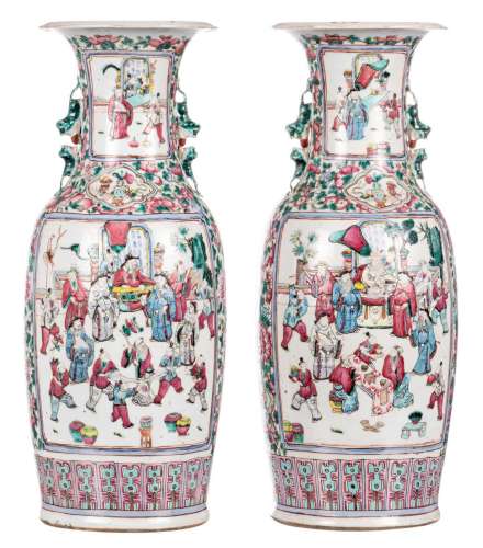 A pair of Chinese famille rose vases, decorated with court scenes, 19thC, H 60 cm