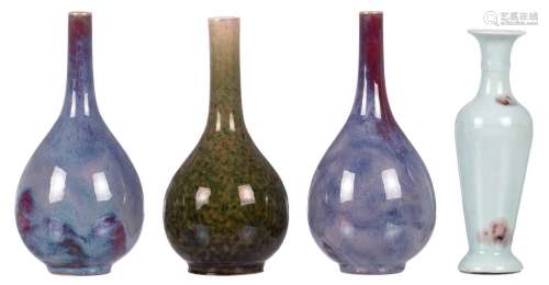 A pair of Chinese flambé glazed bottle vases; added a ditto green glazed vase and a celadon and red iron glazed baluster shaped vase, with a Kangxi mark, H 21,5 - 24 cm