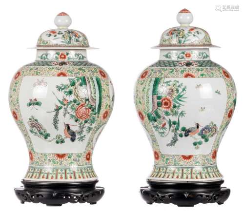 A pair of Chinese famille verte floral decorated vases, the roundels with birds, butterflies and flower branches, on a matching base, H 40 cm (without base)