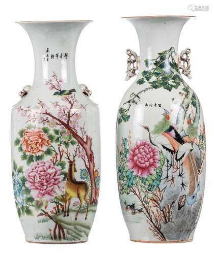 Two Chinese famille rose vases, decorated with flower branches and calligraphic texts, one decorated with a deer and a bird, the other with birds, H 56,5 - 58 cm