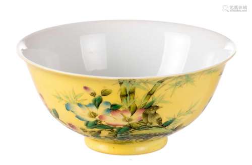 A Chinese yellow ground polychrome decorated bowl with birds, flower branches and a calligraphic text, marked Guangxu, H 7 - Diameter 15 cm
