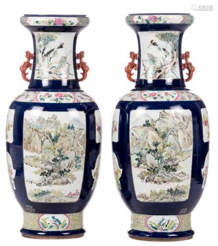 A pair of Chinese vases, blue ground, the roundels famille rose decorated with birds, flower branches and landscapes, 19thC, H 86 cm (minor crack)
