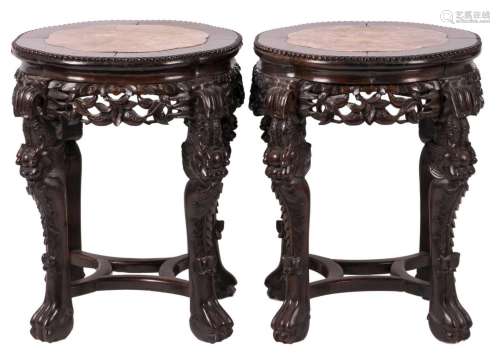 A pair of Chinese carved hard wooden stools with marble top, H 58 - D 54 cm
