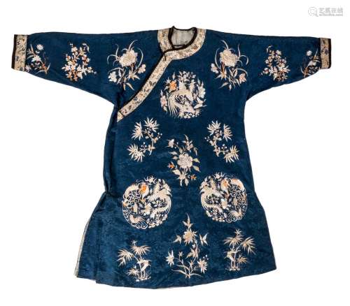 A Chinese silk embroidered robe, floral decorated, with dragons and phoenix, late Qing dynasty, L 132 cm (minor damage)