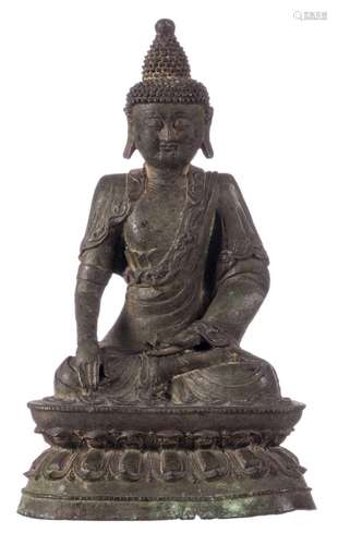 A Chinese bronze seated Buddha, with traces of gilt, Ming and period, H 35 cm