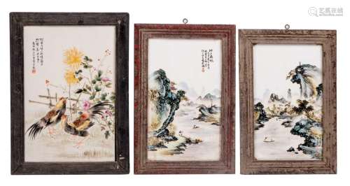 Two Chinese polychrome plaques, decorated with river landscapes, Wang Xiao Ting; added a ditto plaque, decorated with cocks in a garden, Zou Fu Ho, 19 x 32 / 20,5 x 33,5 cm // 24 x 37 cm