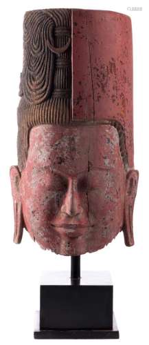 A polychrome decorated Cambodian double mask depicting Vishnoe/Shiva, on a matching wooden base, 19thC, H 135 (with base) - 102 (without base) - B 57 cm