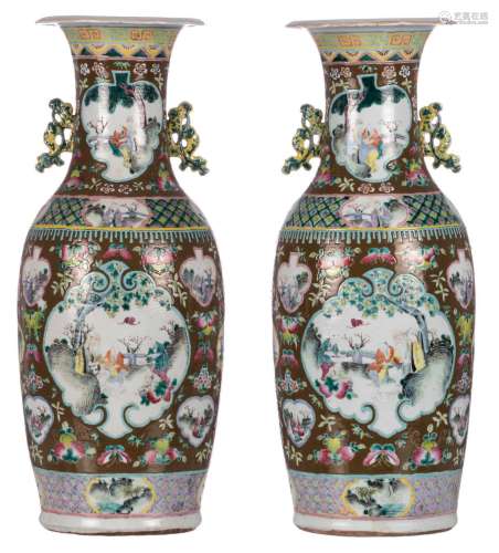 A pair of Chinese brown ground famille rose floral vases, the roundles with animated scenes, 19thC, H 60 cm
