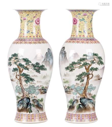 A pair of Chinese famille rose and polychrome decorated baluster shaped vases with figures in a mountainous river landscape and calligraphic texts, signed and marked, H 61,5 cm