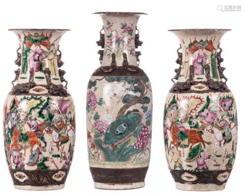 A Chinese famille rose stoneware vase, decorated with birds, flower branches and calligraphic texts, relief decorated, marked, 19thC, H 61,5 cm; added two ditto vases, overall decorated with warriors, H 42,5 cm