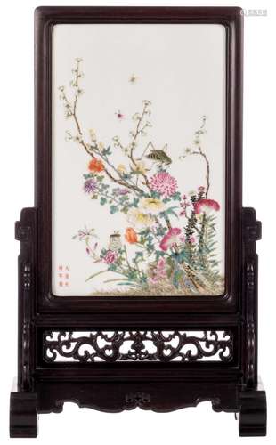 A Chinese famille rose porcelain plaquette, decorated with a cricket and flowers, mounted in a wooden frame, marked, Daqing Guangxu Nian Zhi, 27 x 42,5 cm