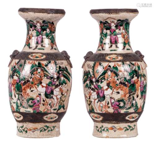 A pair of Chinese polychrome stoneware baluster shaped vases, overall decorated with warrior scenes, marked, about 1900, H 43,5 cm