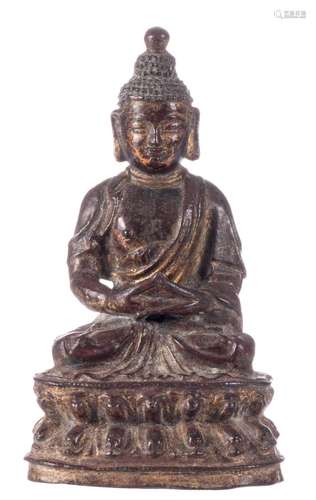 A Chinese bronze seated Buddha, with traces of gilt and polychrome paint, Ming, H 18,5 cm