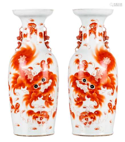 A pair of Chinese iron red vases, decorated with Fu lions and calligraphic texts, 19thC, H 60,5 cm (crack)