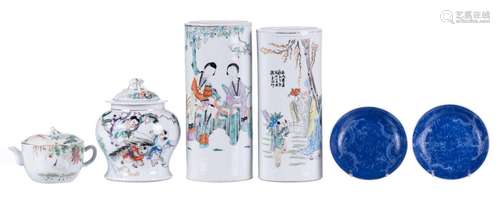 Two Chinese famille rose and polychrome decorated cylinder shaped vases, a ditto vase and cover, and a teapot and cover, marked, H 10- 29 cm; added two Chinese blue ground dragon decorated dishes, marked, D 14,5 cm