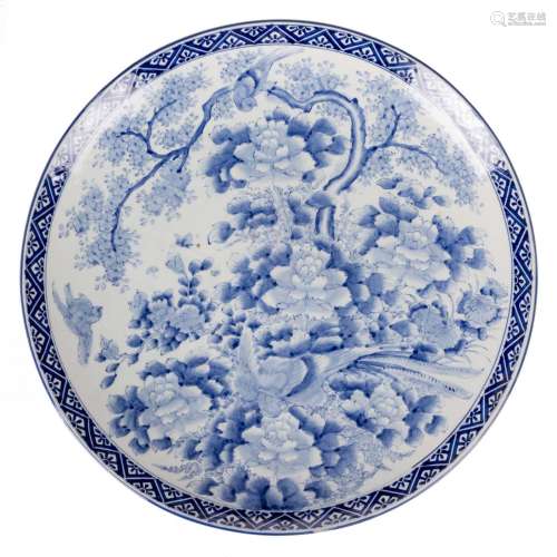 A large Japanese blue and white plate depicting birds on a flower branch, 19thC, Diameter 61 cm
