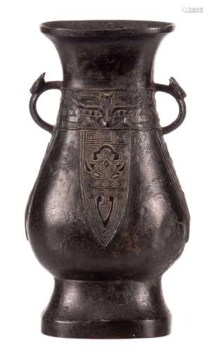 A Chinese archaic bronze relief decorated vase, H 20 cm