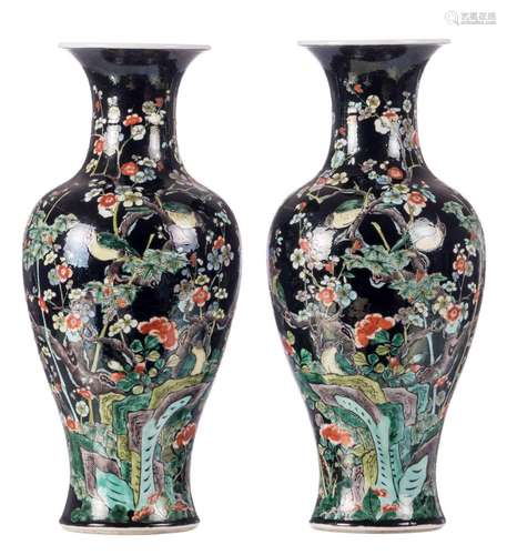 A pair of Chinese famille noire balustered shaped vases, decorated with birds on flower branches, H 46 cm