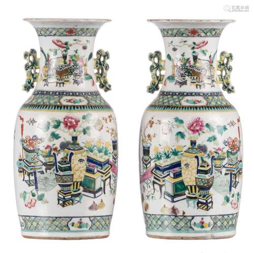 A pair of Chinese polychrome vases, decorated on both sides with kylins and flowers with antiquities, 19thC, H 44 cm (chips)