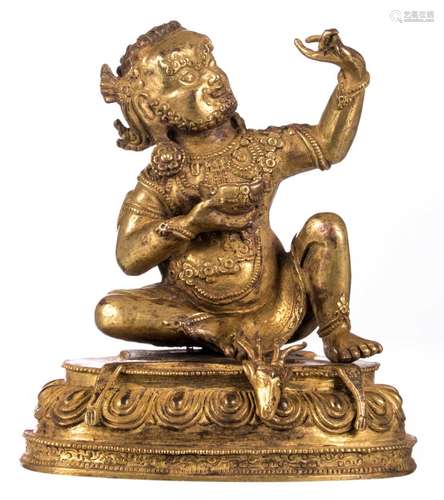 A Sino-Tibetan gilt bronze deity, with traces of polychromy, H 15 cm